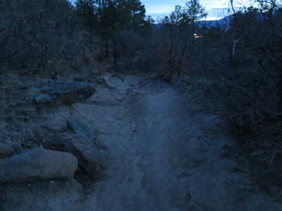 Dusk with no light on a rocky trail